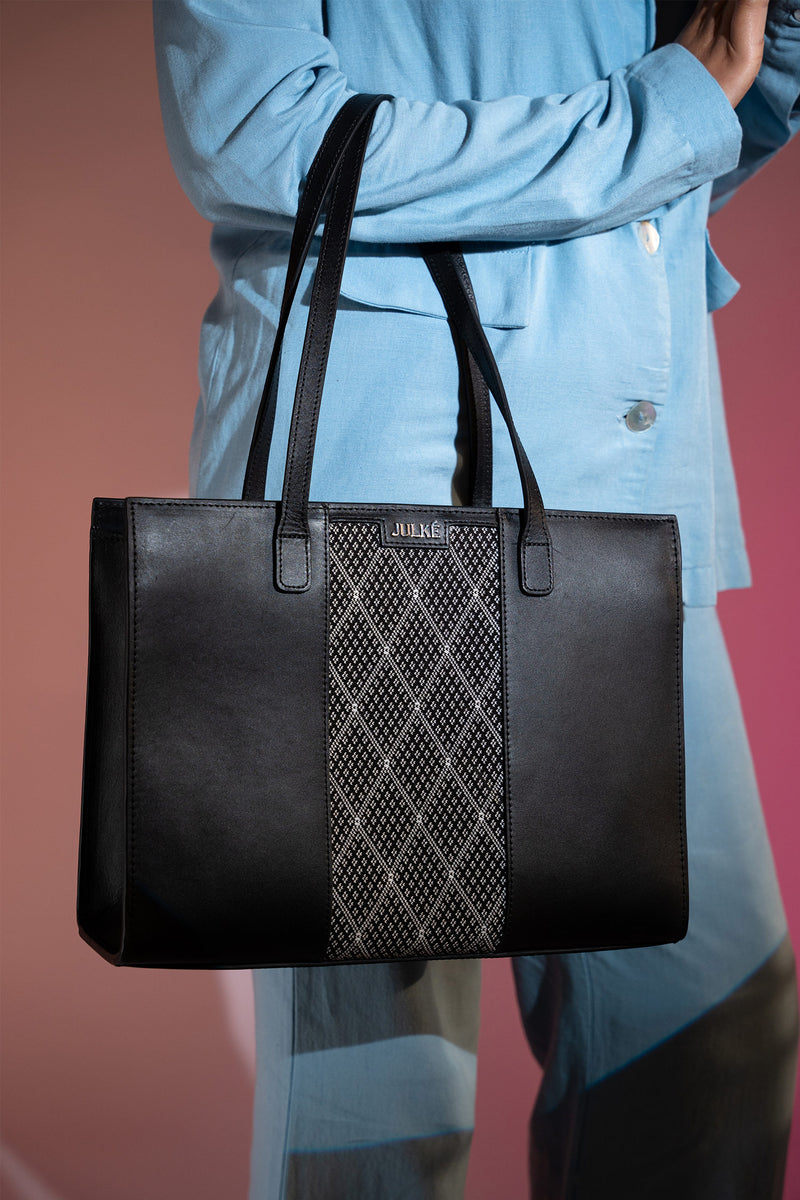 Women's leather tote bag medium size in black colour with diamond pattern fabric strip and detachable shoulder strap by JULKE. 