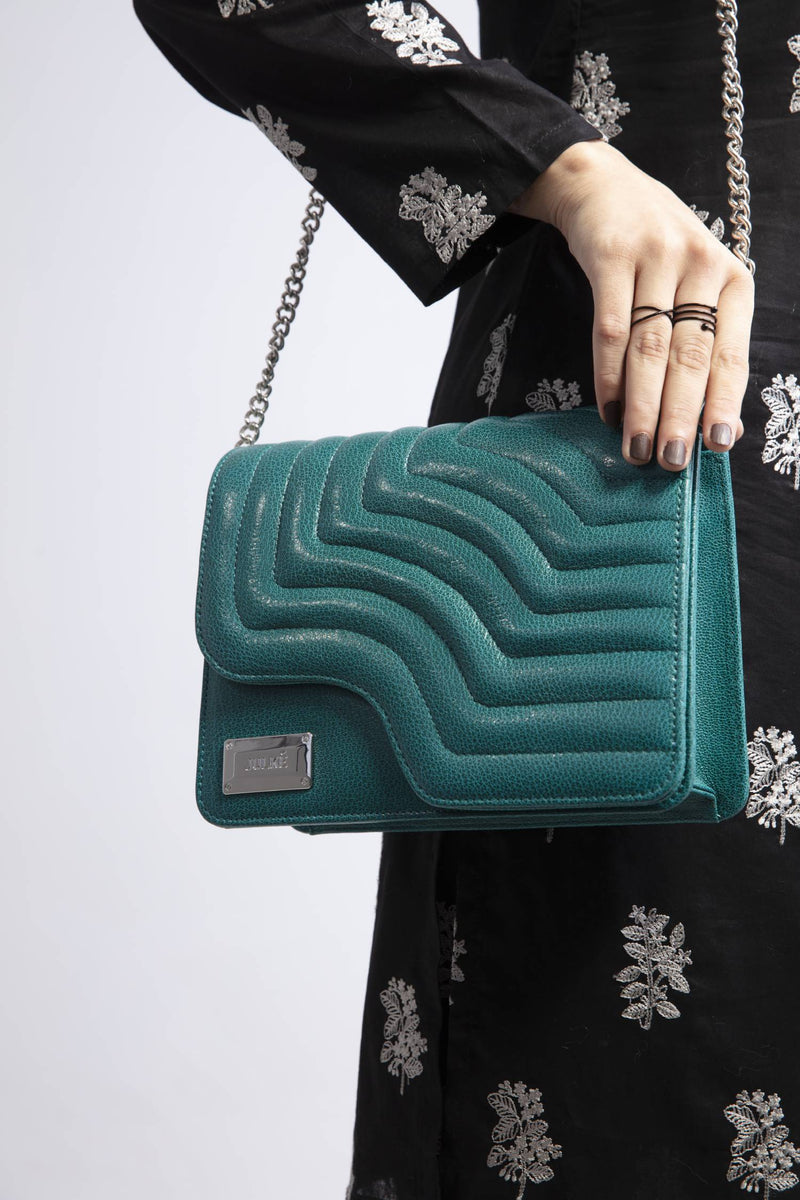 Women leather shoulder bag in turquoise teal colour with quilting by JULKE