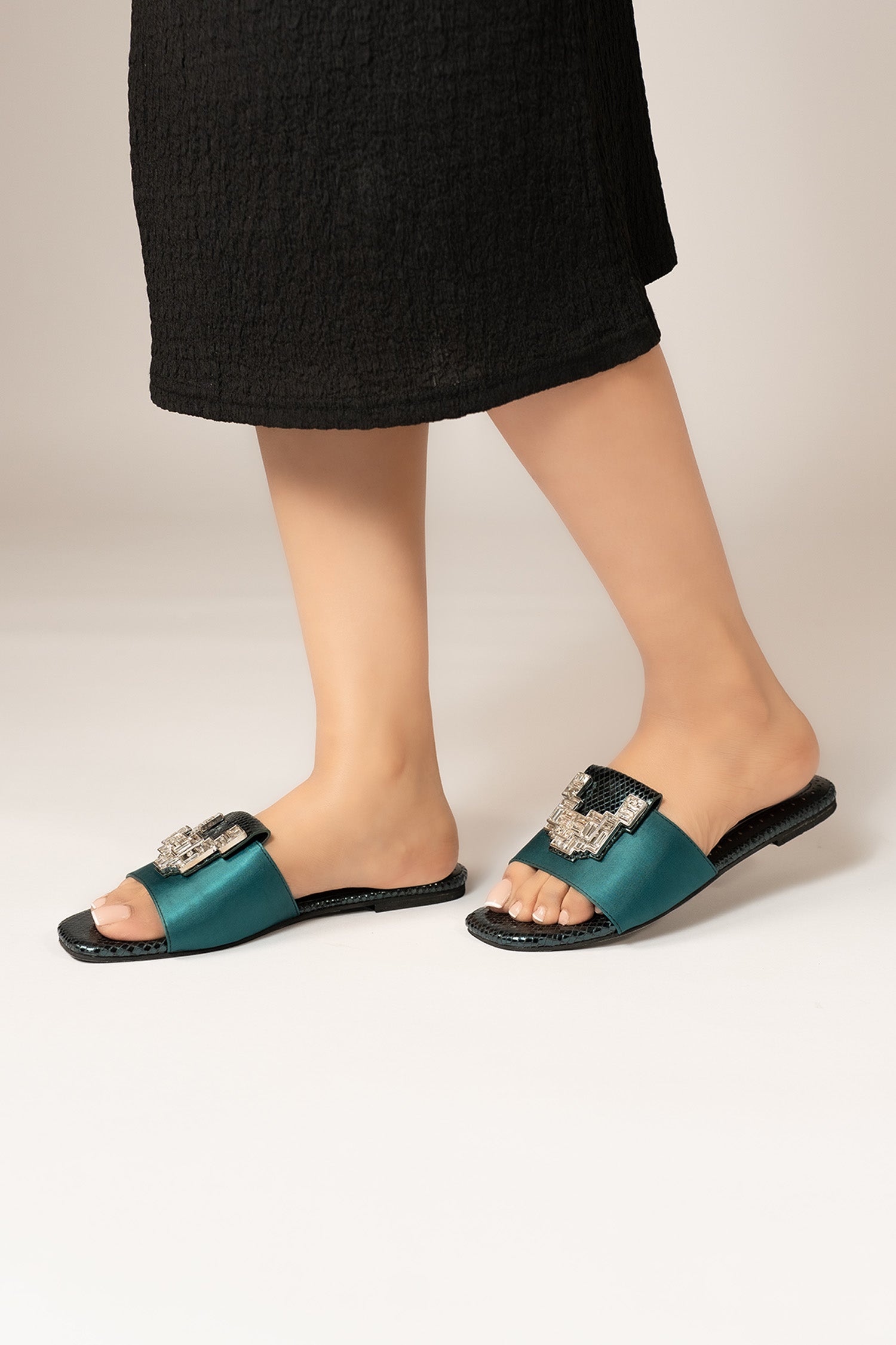 Womens festive flat shoes in dark green colour with green croc texture leatherite on satin strap and geometric silver rhinestone brooch by JULKE. 