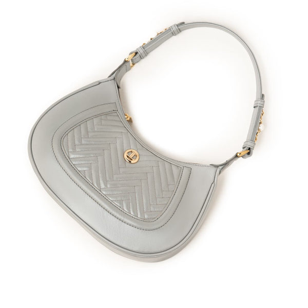 Women's genuine leather shoulder bag in grey with quilted front, gold-tone accents, and adjustable strap by JULKÉ.