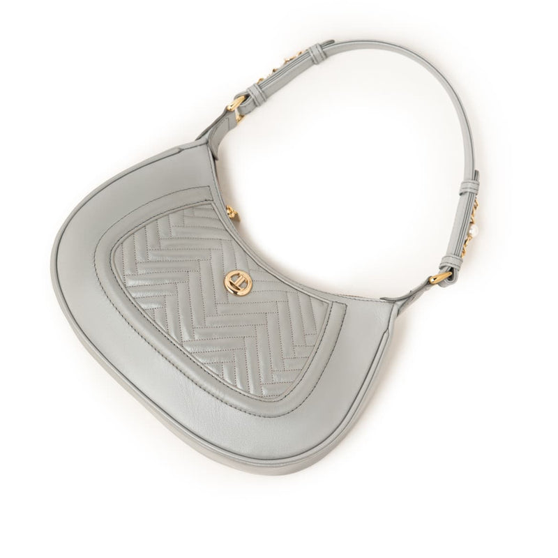Women's genuine leather shoulder bag in grey with quilted front, gold-tone accents, and adjustable strap by JULKÉ.