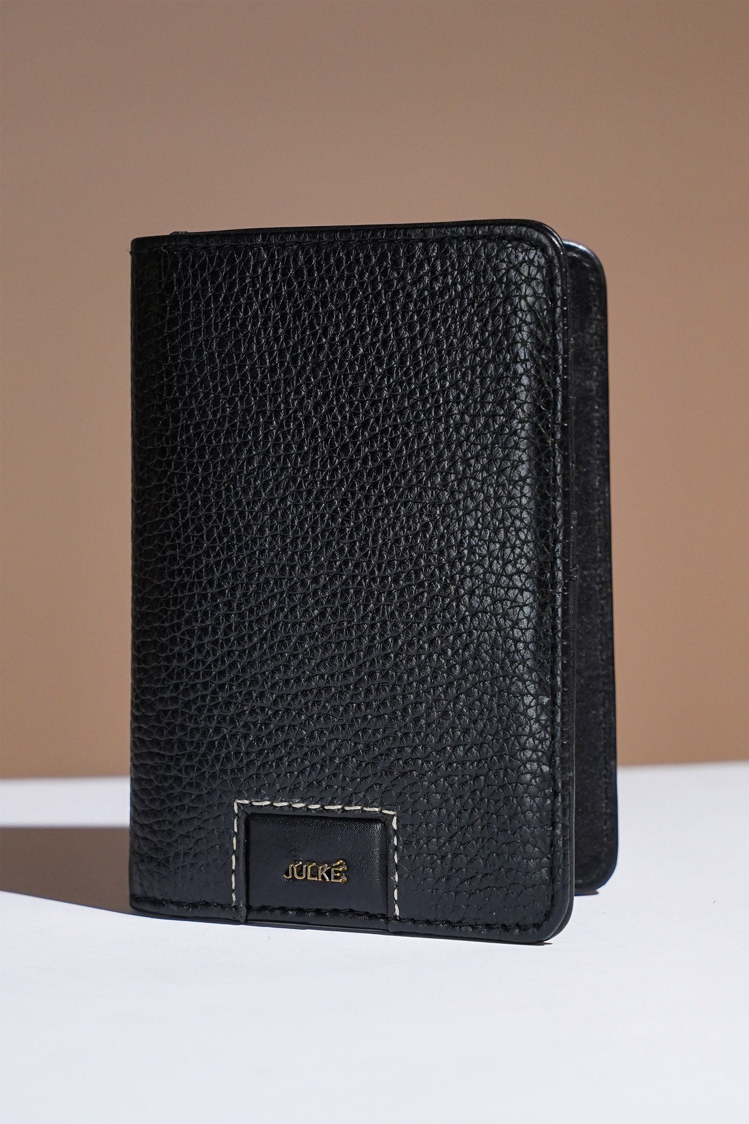 Mens leather bifold passport wallet in black colour with croc texture and contrast stitching by JULKE