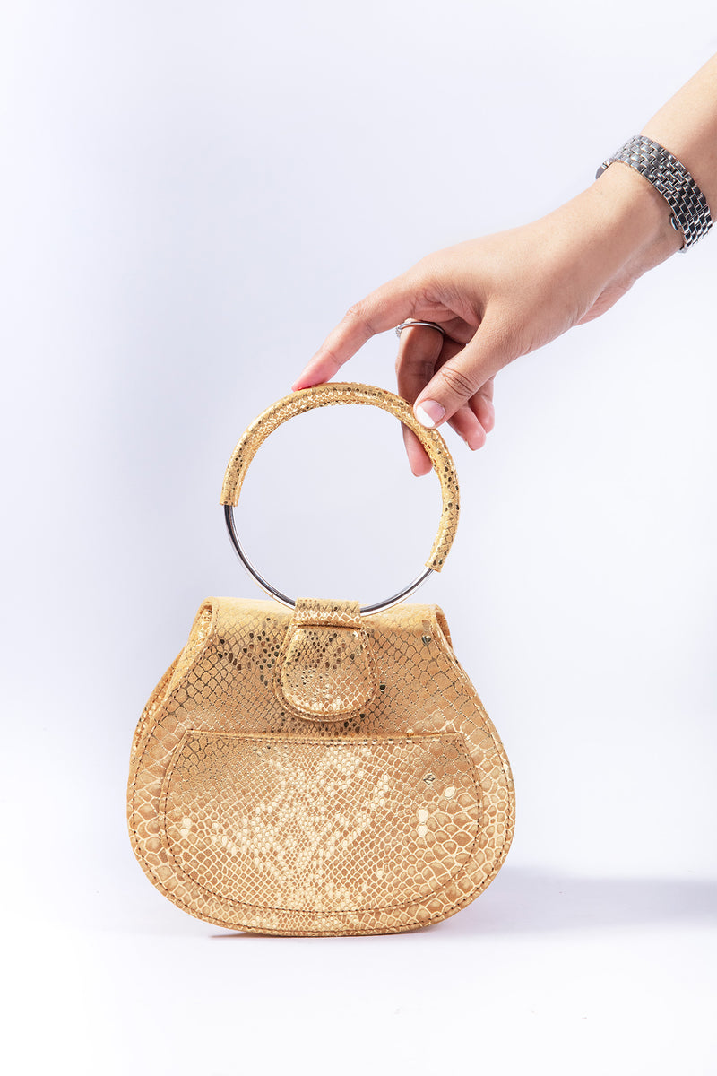 Womens leather bag in gold colour with snake print by JULKE