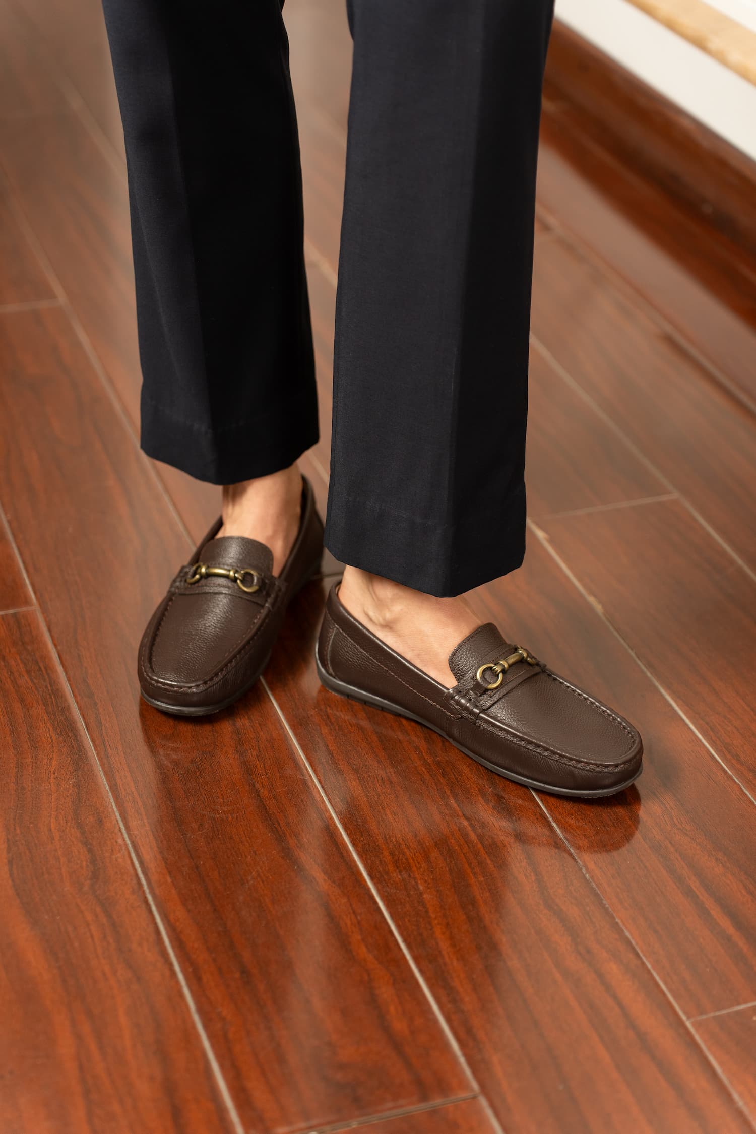 Mens Milled grain leather moccasins in dark brown colour with metallic antique gold horsebit buckle by JULKE. 