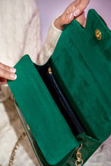 Women's leather top handle shoulder bag in green coloured patent and suede with golden chain and buckle brooch by JULKE