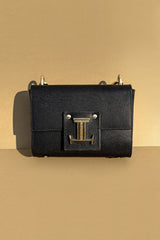Women's leather top handle bag in black colour with accordion gusset and golden chain handle by JULKE