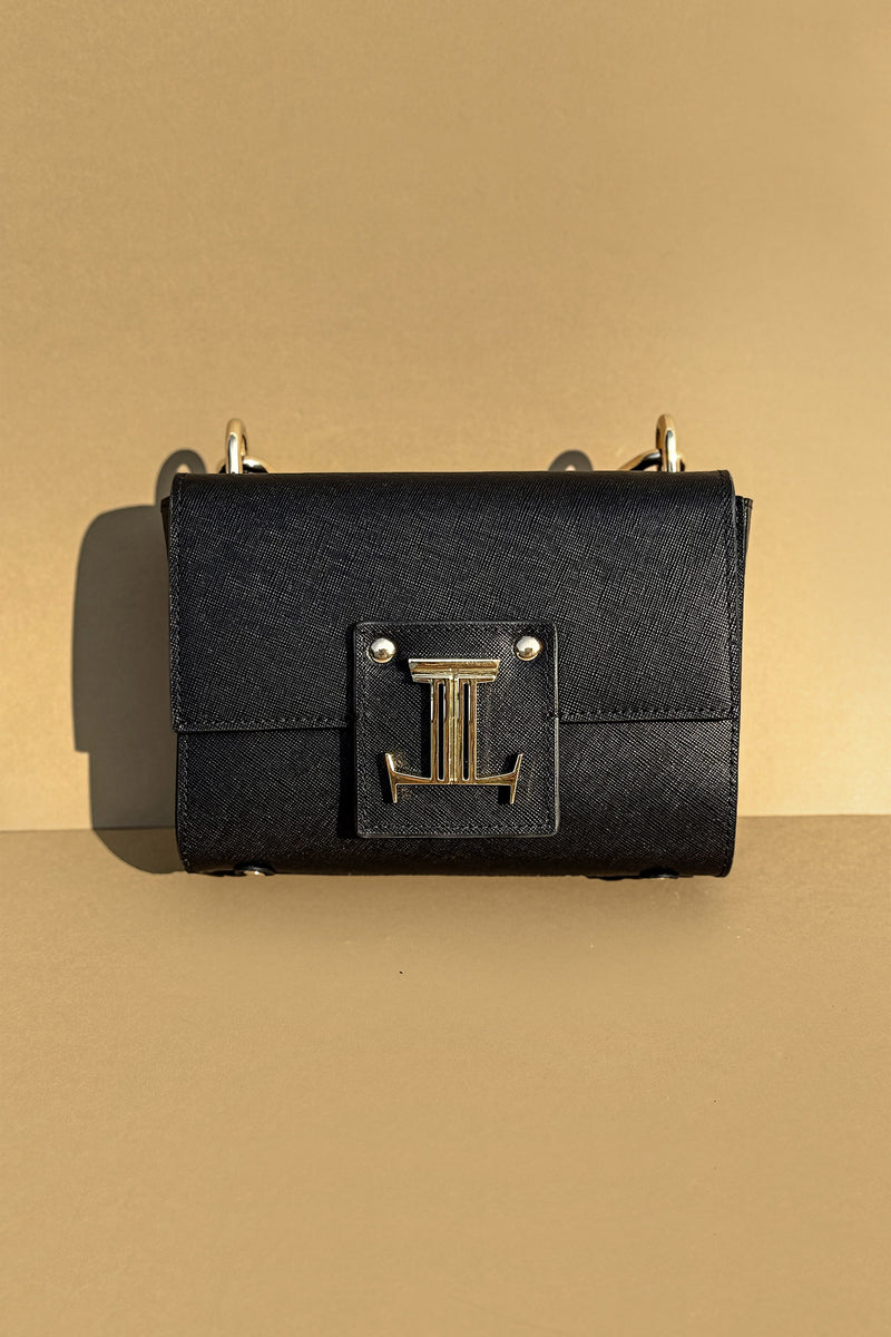 Women's leather top handle bag in black colour with accordion gusset and golden chain handle by JULKE