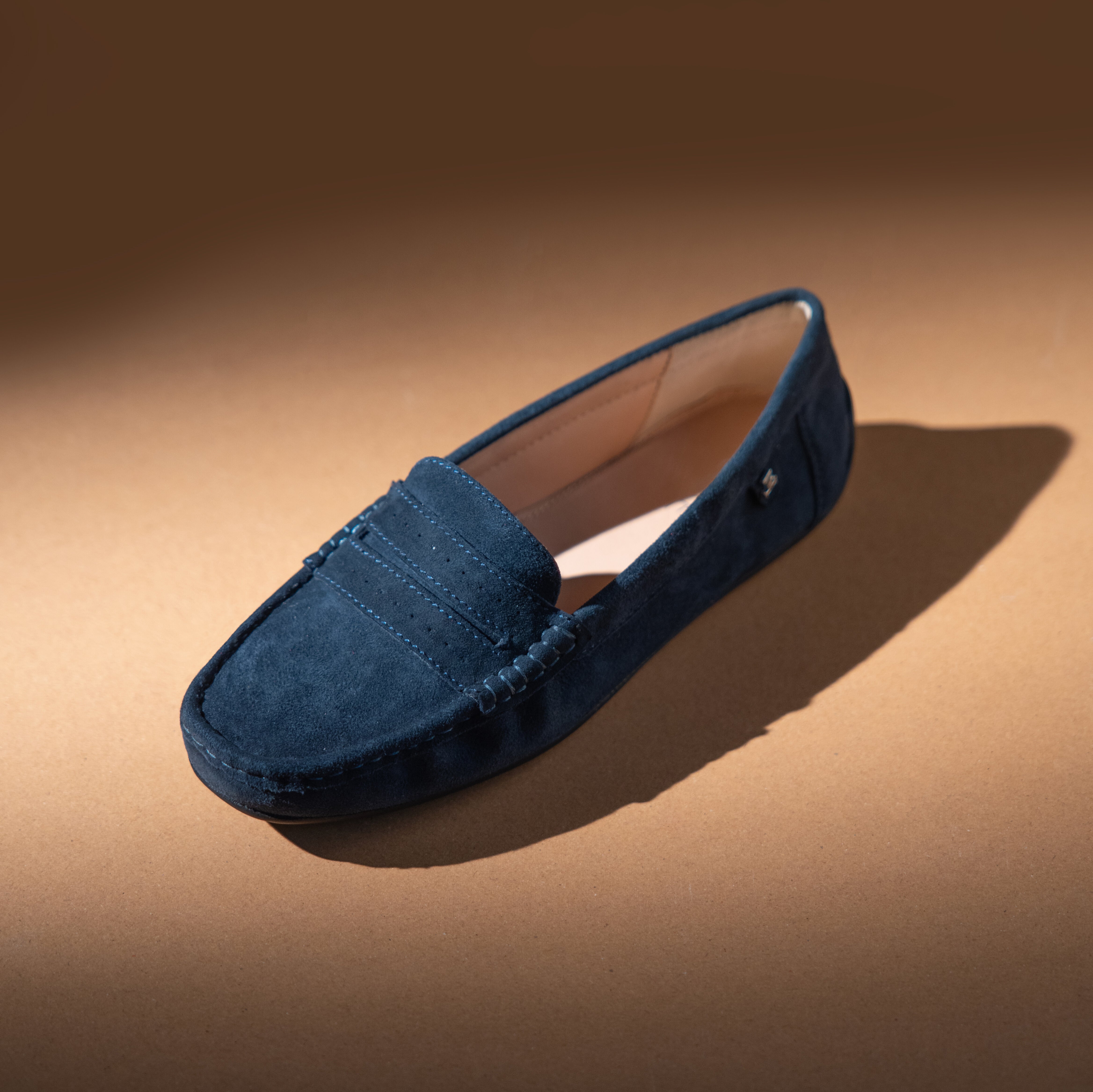 Women's winter suede leather moccasins in dark blue colour with metal logo trim and moc toe by JULKE 