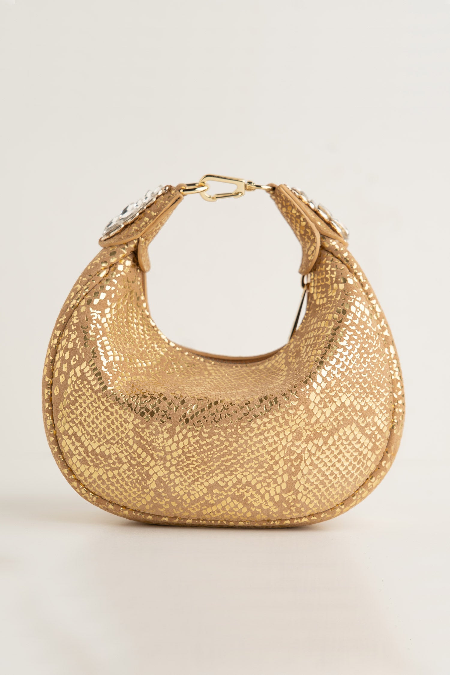 Women's leather mini halfmoon bag in gold colour with 3d reptile texture and unique clip-on handle by JULKE 