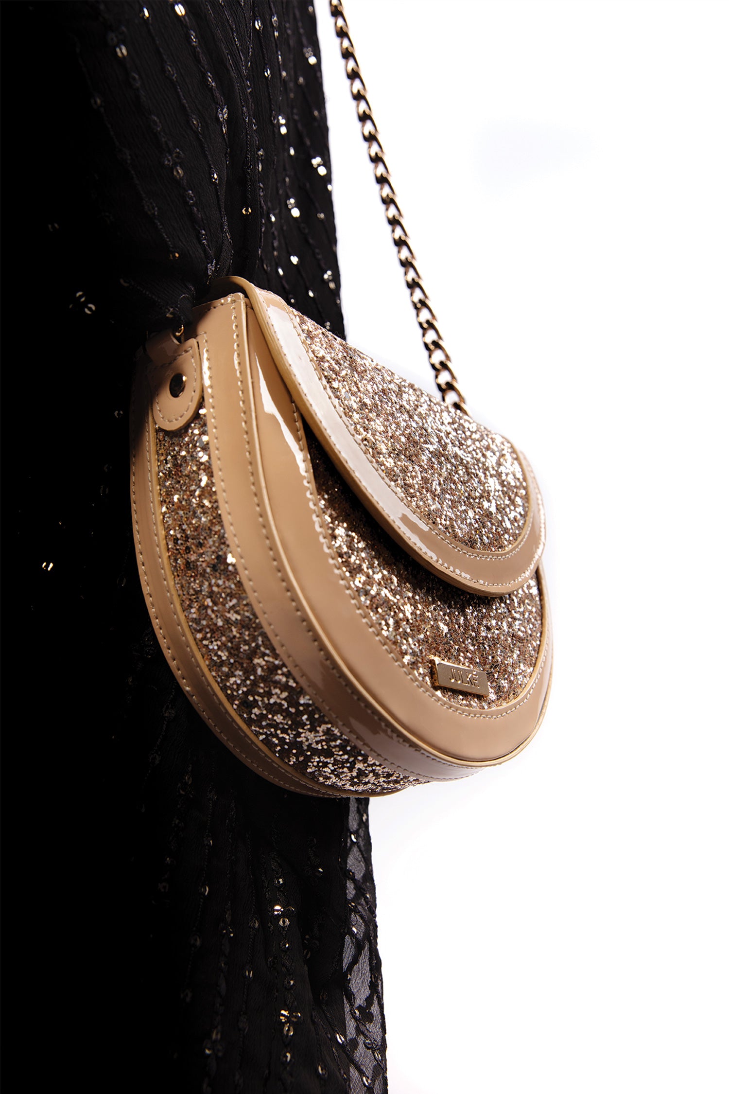 Womens leather round shoulder bag in beige colour with glitter, glossy patent and gold chain by JULKE 