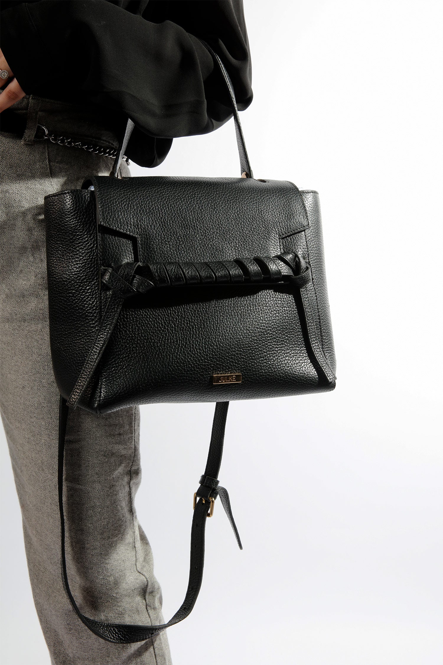 Womens soft leather shoulder bag in black colour with top handle and weaving strap by JULKE