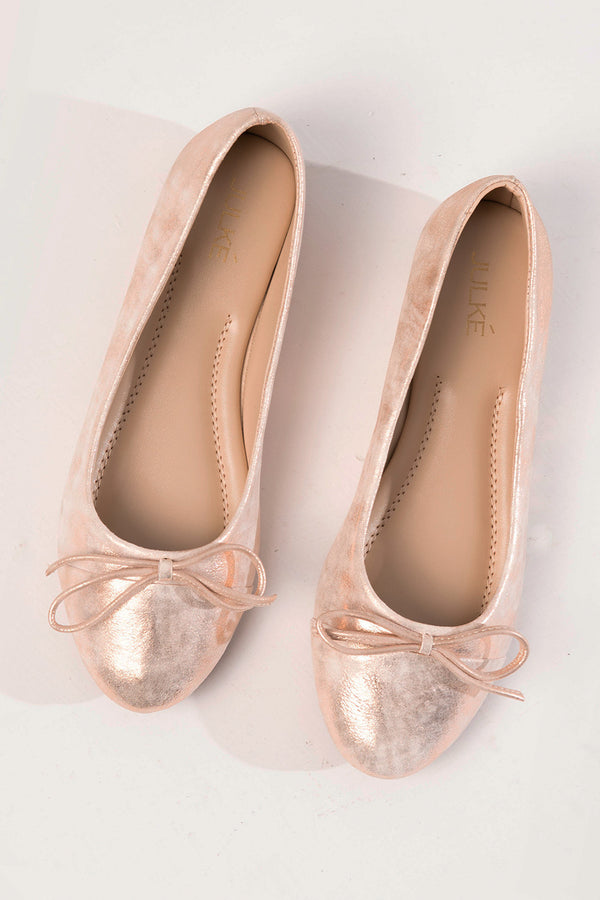 Womens leather flat ballerina pumps in light pink colour with shiny texture and bow by JULKE 