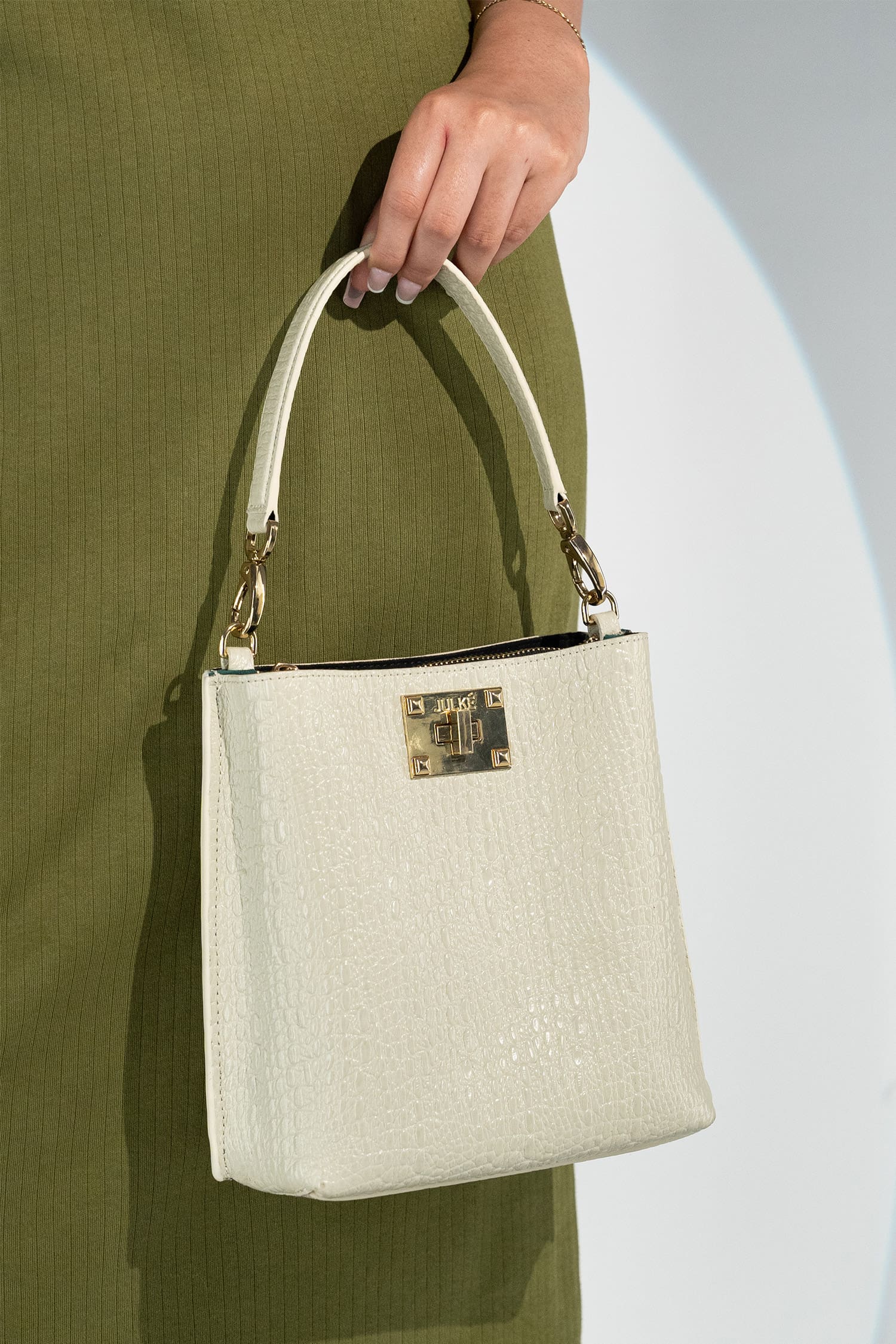 Women's leather bucket bag in off white colour with 3D texture and detachable shoulder strap by JULKE