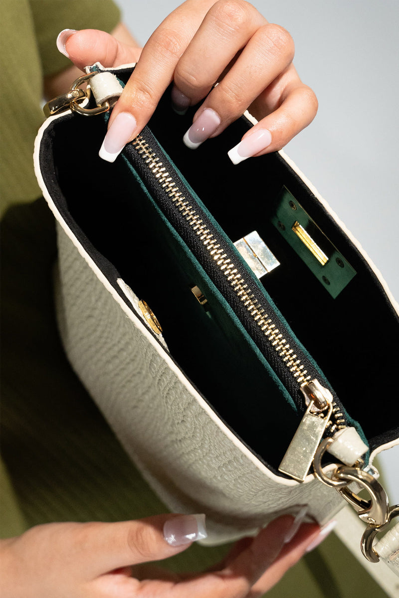 Women's leather bucket bag in off white colour with 3D texture and detachable shoulder strap by JULKE