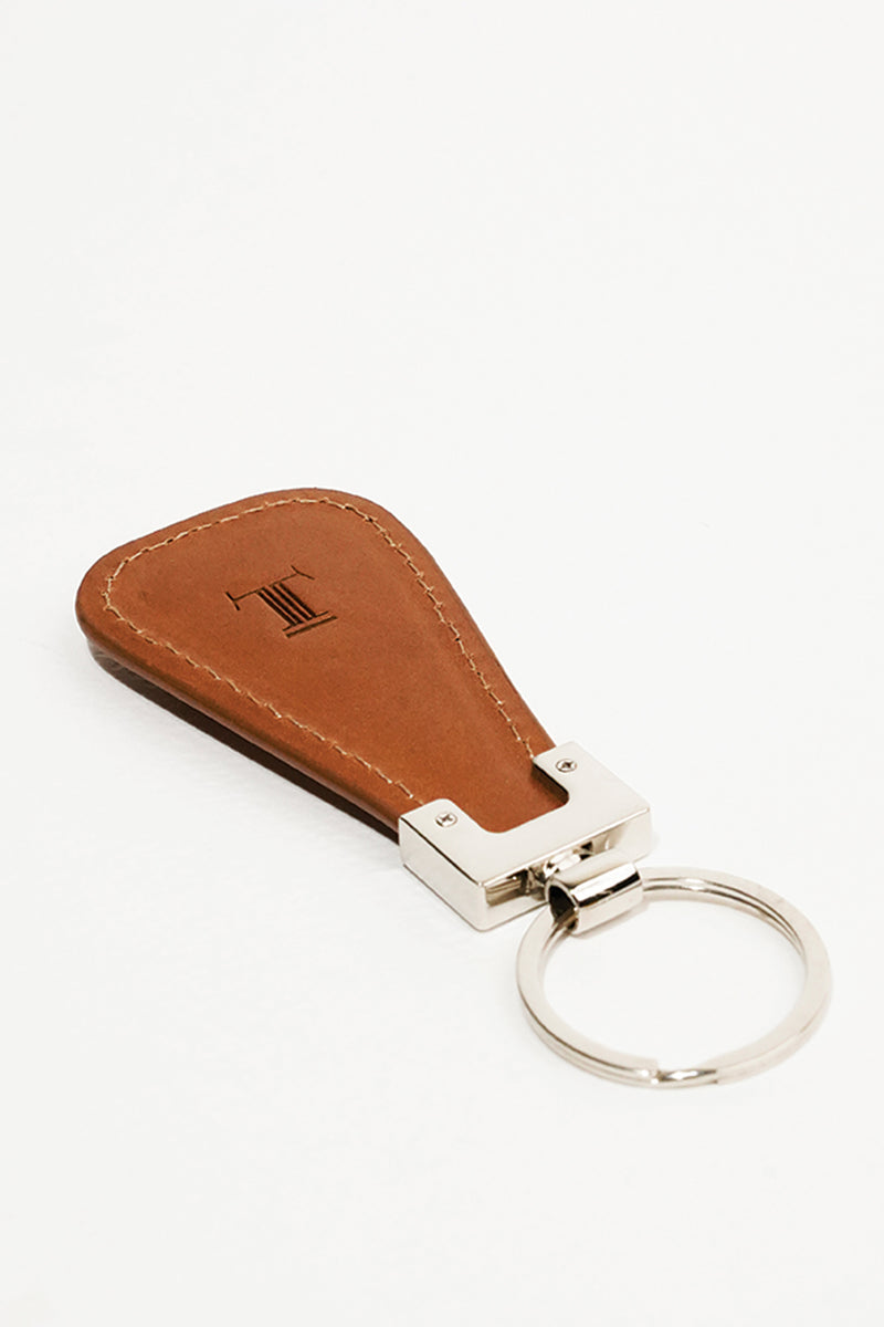 Leather key chain in tan colour in geometric shape and metal ring by JULKE