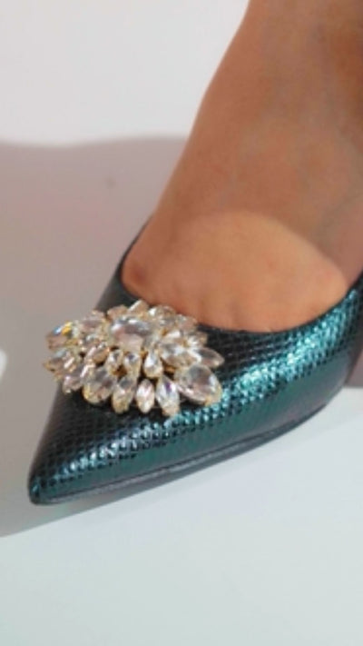 Women's high heel pointed toe pumps in dark green and dark gold colour with shiny reptile texture and flower shaped white rhinestone brooch by JULKE