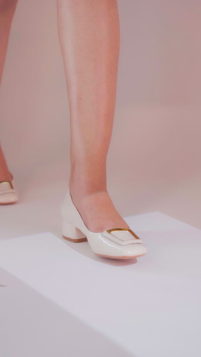 Women's brown and off white block heel pumps with square toe in glossy patent material with matching geometric buckle by JULKE.