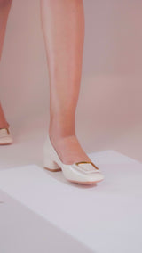 Women's brown and off white block heel pumps with square toe in glossy patent material with matching geometric buckle by JULKE.
