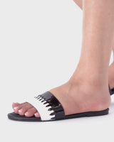 Women summer flat shoes in black and white colour with weaving by JULKE
