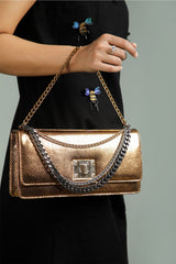 Womens leather shoulder clutch bag in bronze colour with muti chains by JULKE