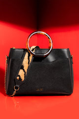 Womens leather shoulder bag with fur strap and plastic round handle in black colour by JULKE