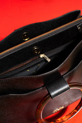 Womens leather shoulder bag with fur strap and plastic round handle in black colour by JULKE