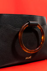 Womens leather shoulder bag with fur strap and plastic round handle in black colour by JULKE