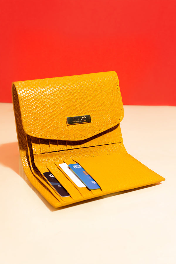 Womens reptile textured leather small trifold wallet in yellow colour with extra card pockets. 