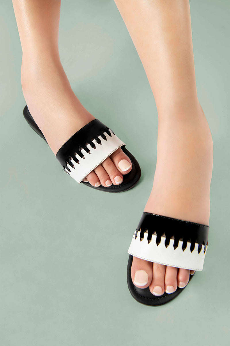 Women summer flat shoes in black and white colour with weaving by JULKE