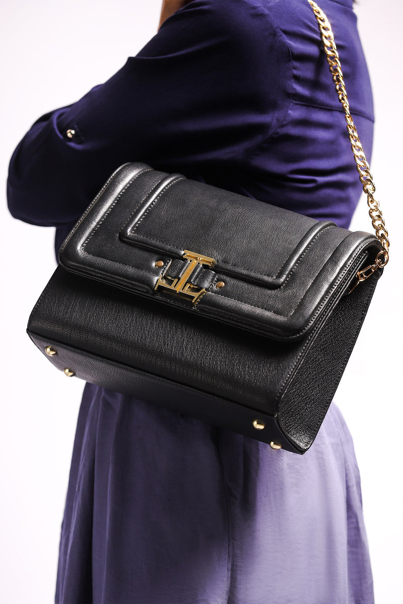 Womens leather shoulder bag with gold chain strap in black colour by JULKE