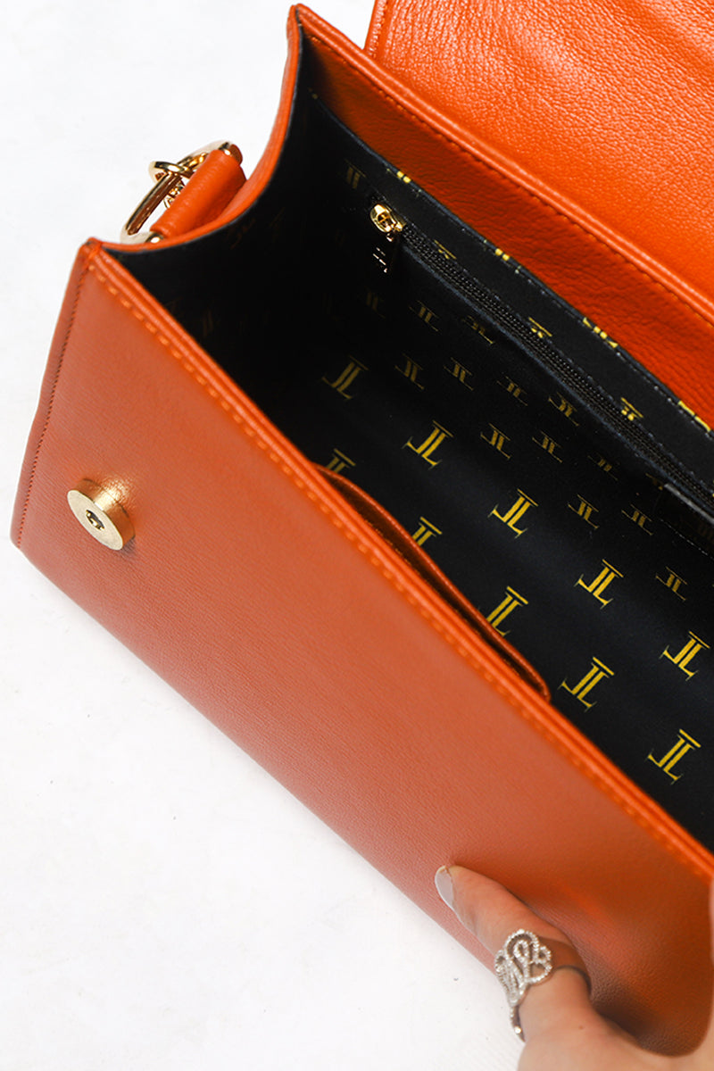 Womens leather shoulder bag with gold chain strap in orange tan colour by JULKE