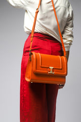 Womens leather shoulder bag with gold chain strap in orange tan colour by JULKE