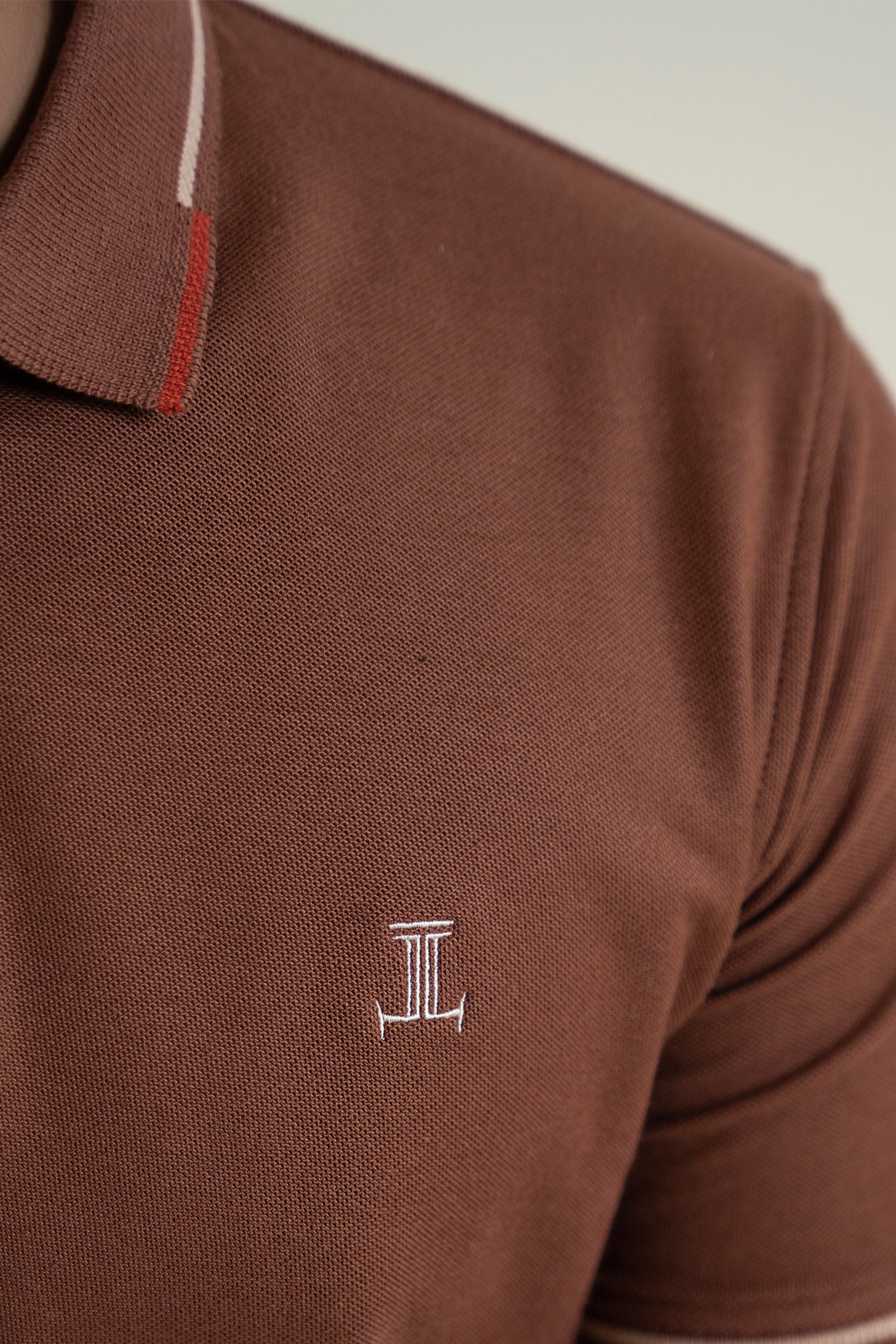 Mens polos shirt in brown colour with red and wwhite tipped sleeves and collar by JULKE. 