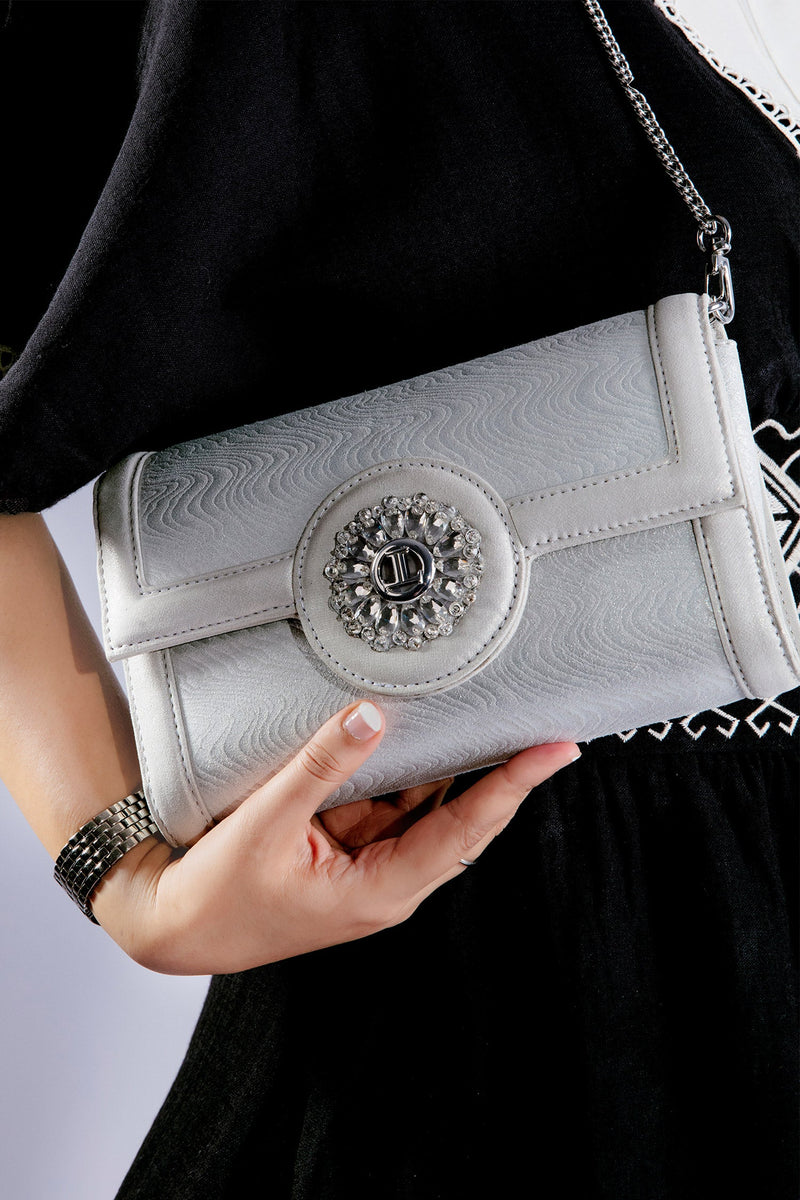 Womens leather shoulder bag and clutch in silver colour with flower diamante brooch by JULKE
